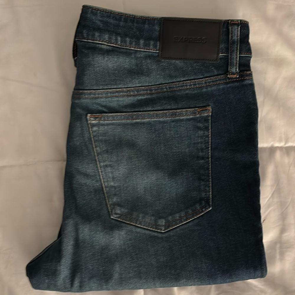 One pair of blue denim jeans.